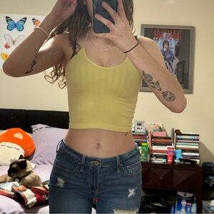 small yellow tanktop with white spaghetti straps :)